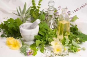 Mortal and Pestle and herbs and oils